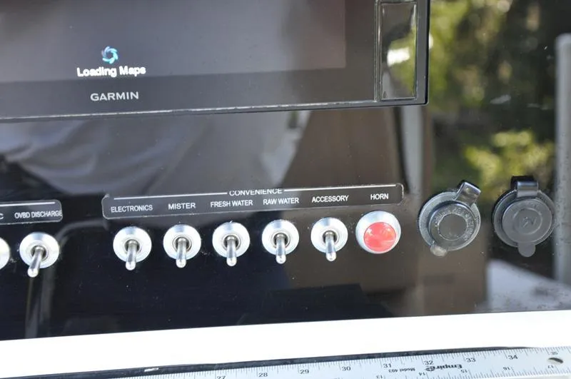 Slide: The Image of Control panel of a 2019 Sportsman Masters 267 Bay Boat with Garmin display. - 24