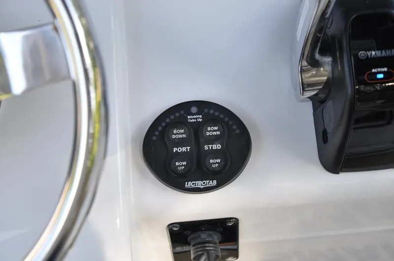 Slide: The Image of Control panel of a 2019 Sportsman Masters 267 Bay Boat with Lectrotab trim tab switches. - 26