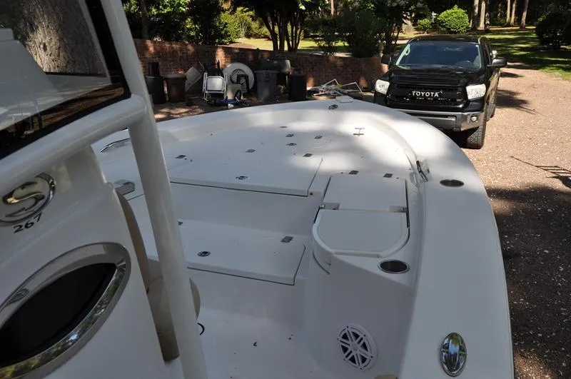 Slide: The Image of 2019 Sportsman Masters 267 Bay Boat parked near a black Toyota truck. - 30