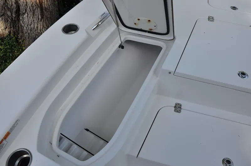 Slide: The Image of 2019 Sportsman Masters 267 Bay Boat storage compartment open, showcasing interior space. - 33