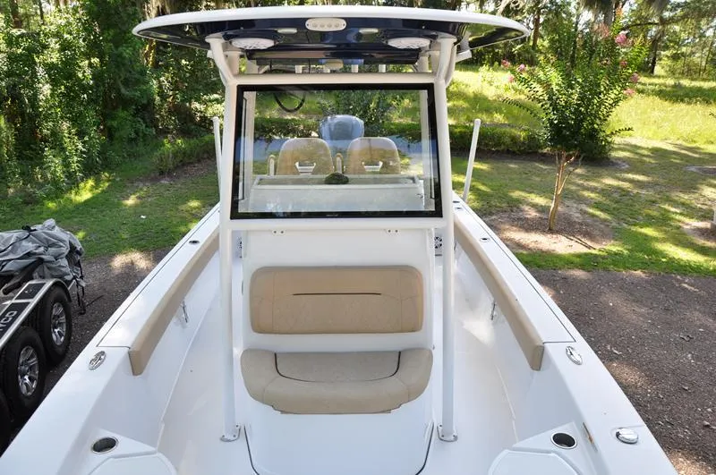 Slide: The Image of 2019 Sportsman Masters 267 Bay Boat with seating and console, parked outdoors. - 37