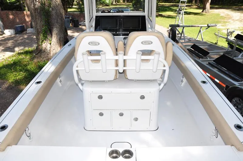 Slide: The Image of 2019 Sportsman Masters 267 Bay Boat interior with dual seats and control panel. - 6