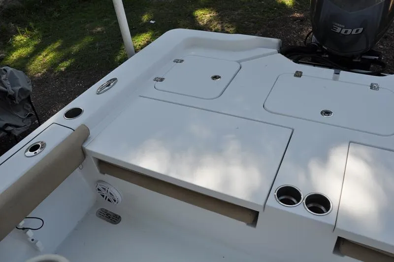 Slide: The Image of 2019 Sportsman Masters 267 Bay Boat deck with storage compartments and cup holders. - 9