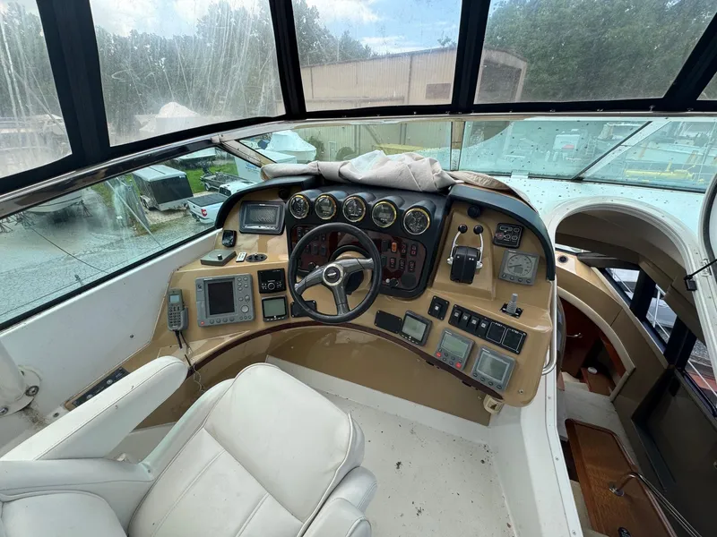Slide: The Image of Pilothouse interior of 2003 Carver 570 Voyager, featuring navigation controls and gauges. - 10