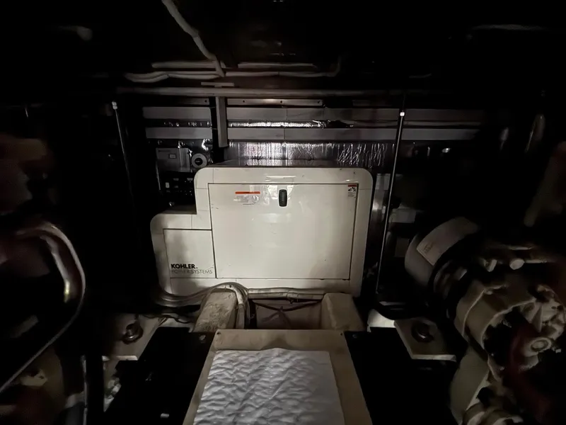 Slide: The Image of Engine room of 2003 Carver 570 Voyager Pilothouse with Kohler power system. - 12