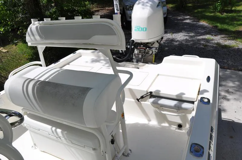 Slide: The Image of 2017 Skeeter SX 210 boat interior with seating and outboard motor. - 19