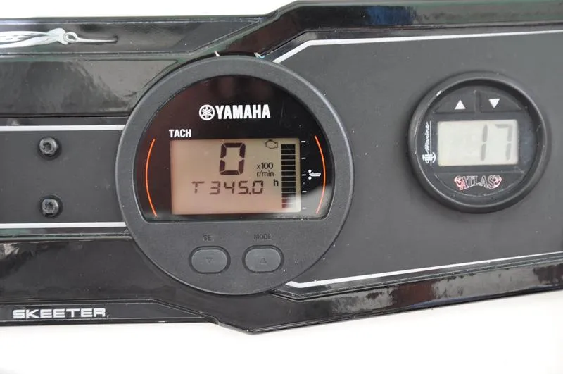 Slide: The Image of Yamaha tachometer on 2017 Skeeter SX 210 boat dashboard, displaying 345 hours. - 35