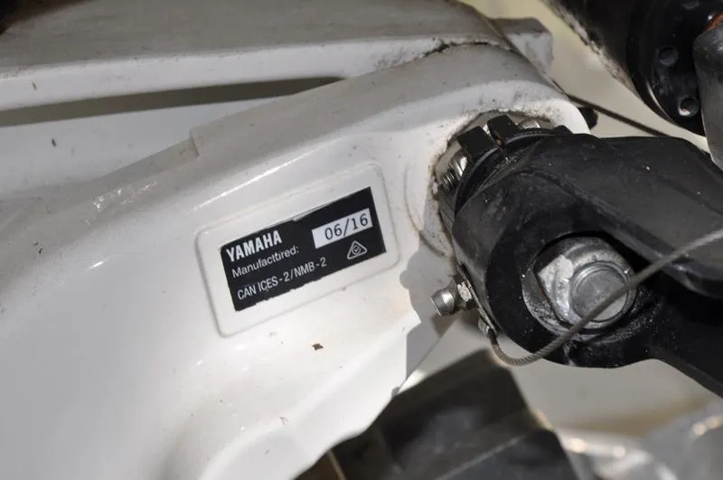 Slide: The Image of Yamaha component on 2017 Skeeter SX 210 boat, showing manufacturing label and hardware details. - 39