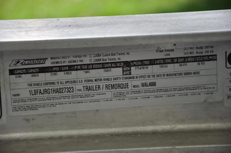 Slide: The Image of Label on EZ Loader trailer, model WAL4000, showing specifications and compliance details. - 41