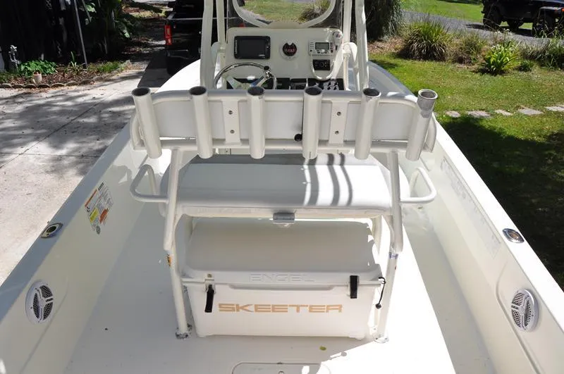 Slide: The Image of 2017 Skeeter SX 210 boat interior with rod holders and console. - 8