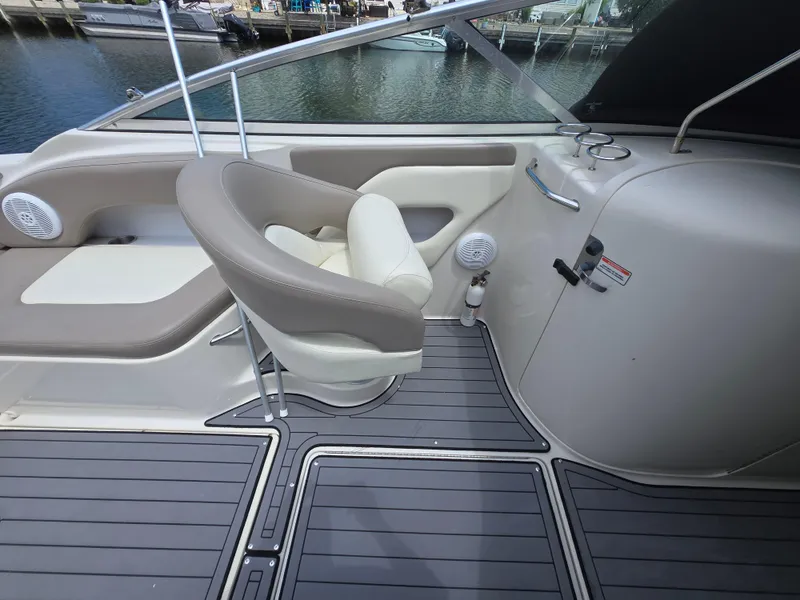 Slide: The Image of 2006 Sea Ray 270 Sundeck interior with seating and deck details. - 21