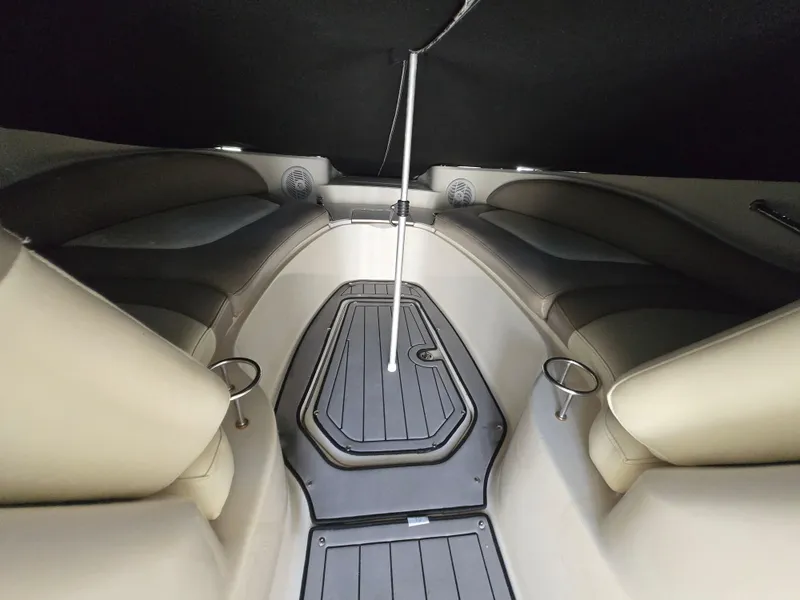 Slide: The Image of Interior of 2006 Sea Ray 270 Sundeck boat, featuring seating and cup holders. - 24