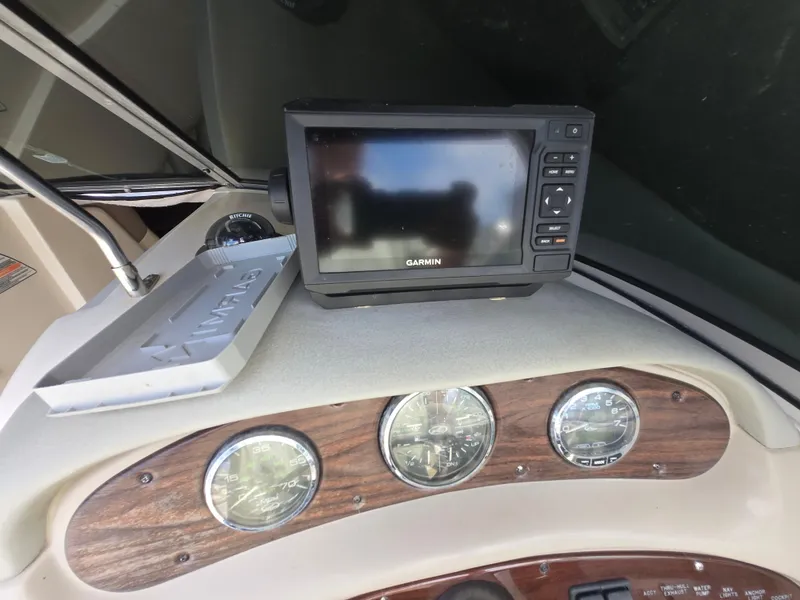 Slide: The Image of Dashboard of 2006 Sea Ray 270 Sundeck with Garmin GPS and gauges. - 25