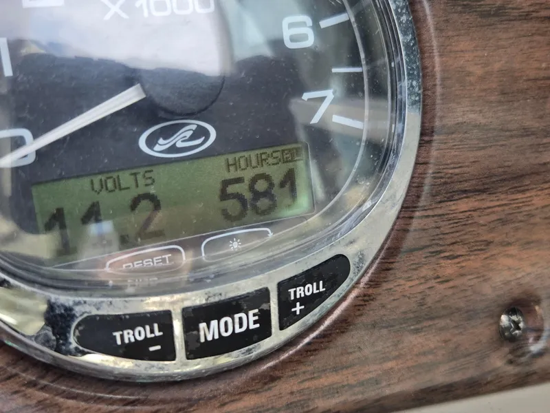 Slide: The Image of Close-up of 2006 Sea Ray 270 Sundeck dashboard showing 14.2 volts and 581 hours. - 5