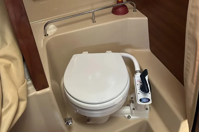 Slide: The Image of 2019 Ranger Tugs R-23 boat bathroom with Jabsco marine toilet. - 14