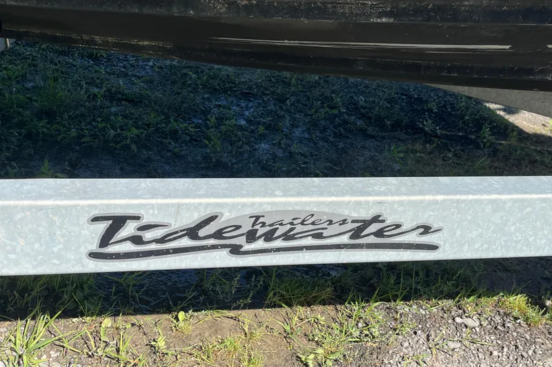 Slide: The Image of Trailer with "Tidewater" logo, supporting a 2019 Ranger Tugs R-23 boat. - 24