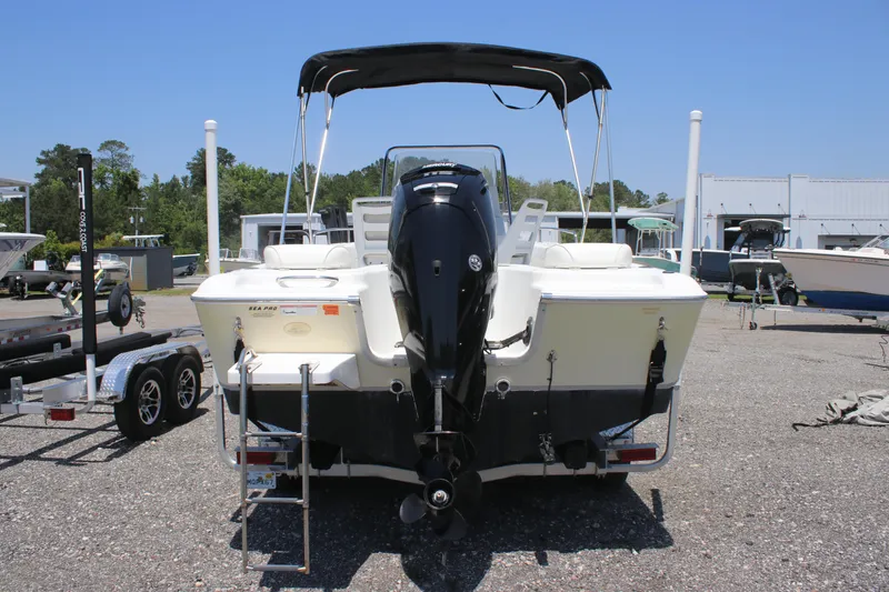 Slide: The Image of 2008 Sea Pro 186 Center Console boat with outboard motor, parked on gravel lot. - 4