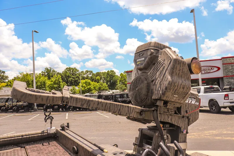 Slide: The Image of 2022 Gator Tail 1860 Extreme Mod V boat motor in a parking lot, sunny day. - 12