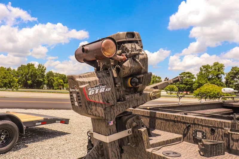 Slide: The Image of 2022 Gator Tail 1860 Extreme Mod V boat engine on trailer, under a clear blue sky. - 13