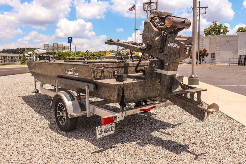 Slide: The Image of 2022 Gator Tail 1860 Extreme Mod V boat on trailer, parked outdoors. - 3