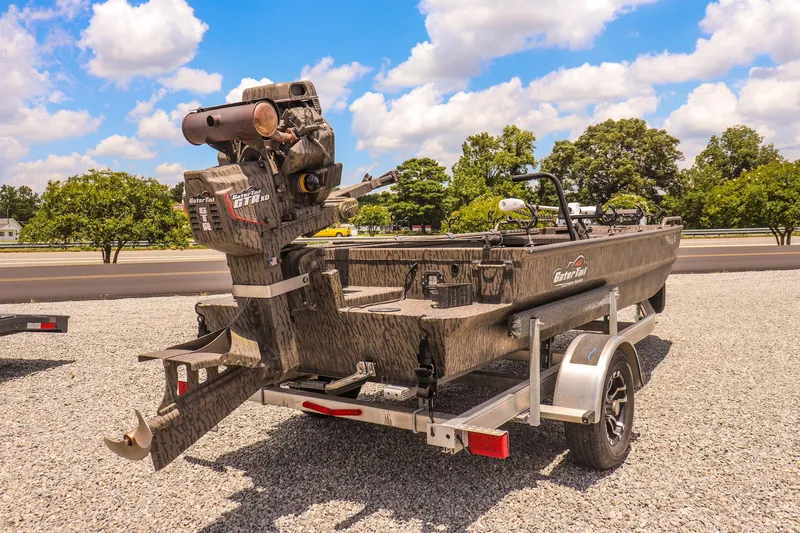 Slide: The Image of 2022 Gator Tail 1860 Extreme Mod V boat on trailer, parked outdoors. - 5