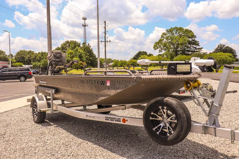 Slide: The Image of 2022 Gator Tail 1860 Extreme Mod V boat on trailer, parked outdoors. - 7