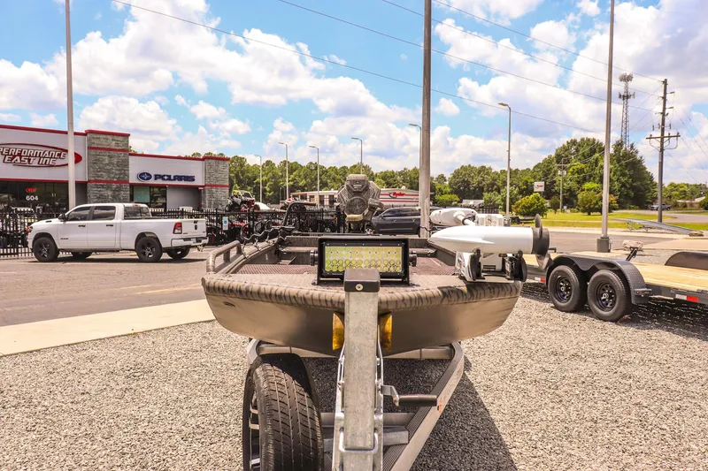 Slide: The Image of 2022 Gator Tail 1860 Extreme Mod V boat on trailer at dealership lot. - 8