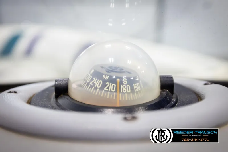 Slide: The Image of Close-up of a boat compass on a 1997 Celebrity 190 model. - 25