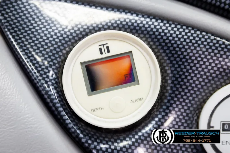 Slide: The Image of Digital depth gauge on a 1997 Celebrity 190 boat dashboard, carbon fiber texture. - 28