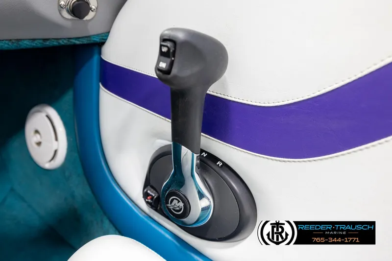 Slide: The Image of Boat throttle control lever in a 1997 Celebrity 190, featuring a sleek design and vibrant colors. - 32