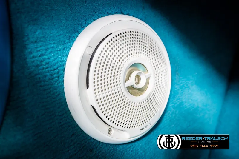 Slide: The Image of White Sony speaker on blue surface, Reeder-Trausch Marine logo visible. - 33