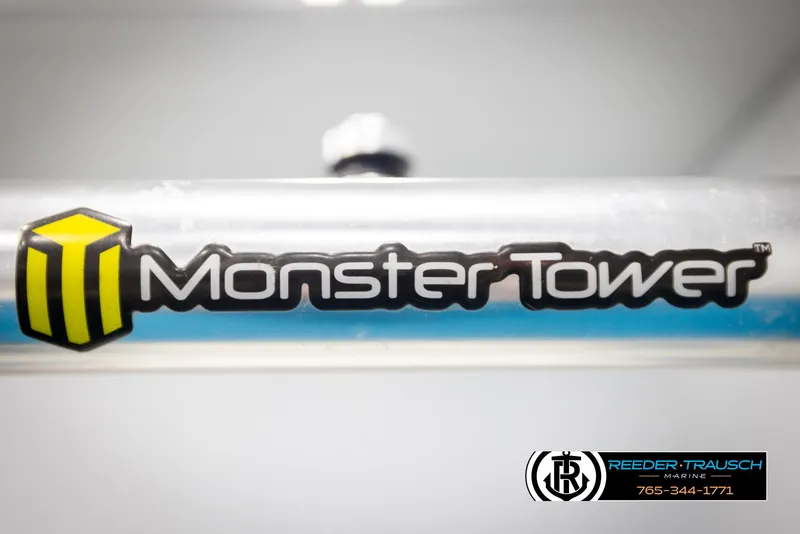 Slide: The Image of Monster Tower logo on a 1997 Celebrity 190 boat, Reeder-Trausch Marine branding visible. - 40