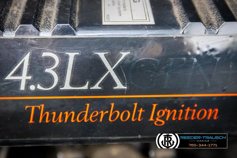 Slide: The Image of Close-up of 1997 Celebrity 190 engine with 4.3LX Thunderbolt Ignition branding. - 42