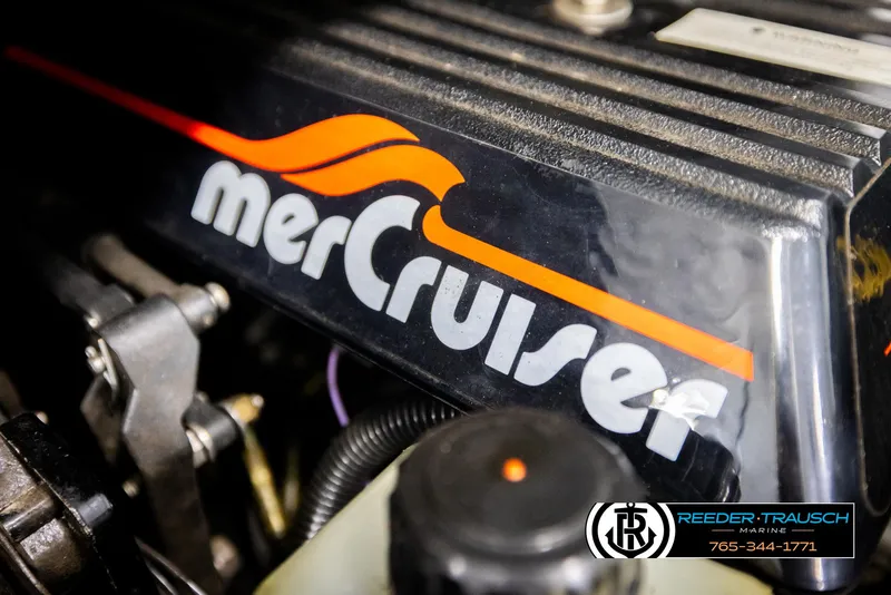 Slide: The Image of Close-up of a MerCruiser engine component with branding, featuring Reeder-Trausch Marine contact details. - 43