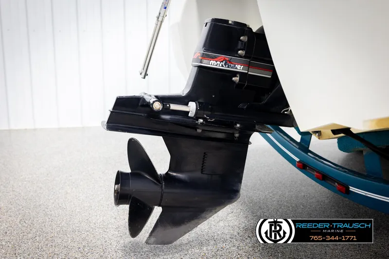 Slide: The Image of Outboard motor of a 1997 Celebrity 190 boat, featuring a MerCruiser engine. - 44