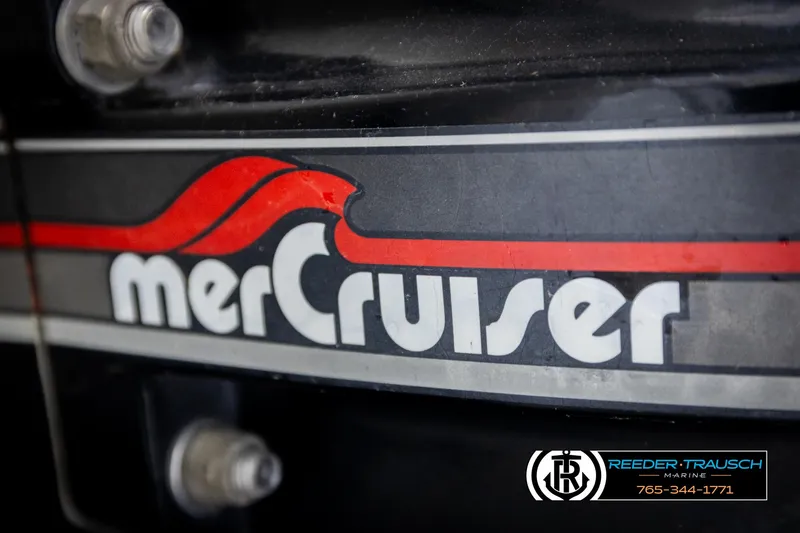 Slide: The Image of Close-up of MerCruiser logo on a 1997 Celebrity 190 boat engine. - 45