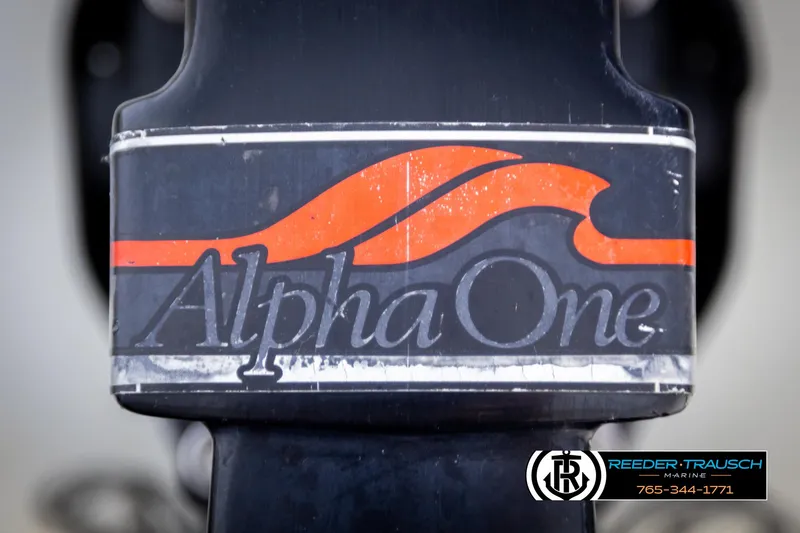 Slide: The Image of Close-up of Alpha One logo on a 1997 Celebrity 190 boat component. - 46