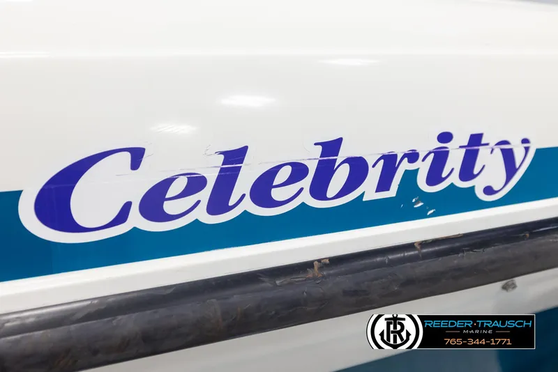 Slide: The Image of 1997 Celebrity 190 boat with blue branding and Reeder-Trausch Marine logo. - 48