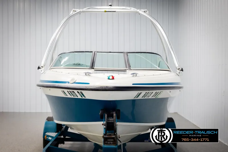 Slide: The Image of 1997 Celebrity 190 boat on trailer in indoor storage facility. - 8