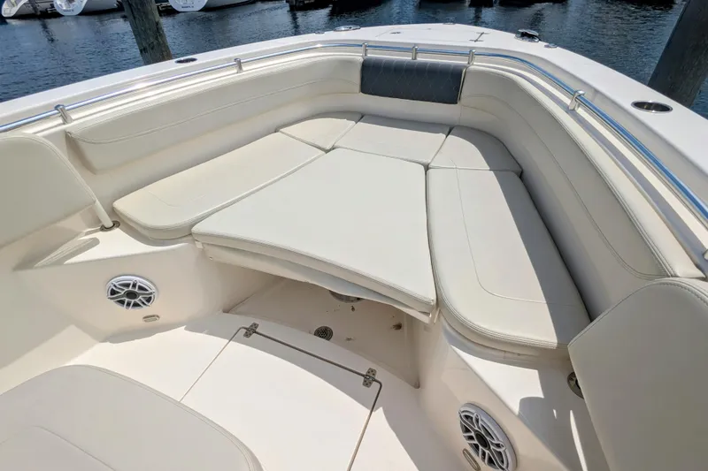 Slide: The Image of 2023 Cobia 280 Center Console boat with spacious seating and modern design. - 24