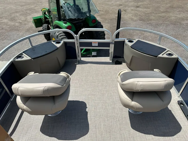 Slide: The Image of 2025 Sun Tracker Bass Buggy 18 DLX pontoon boat interior with seating and storage compartments. - 10