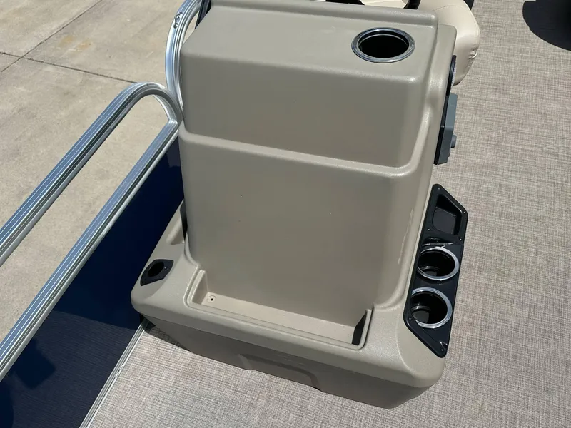 Slide: The Image of 2025 Sun Tracker Bass Buggy 18 DLX console with cup holders and storage compartments. - 21