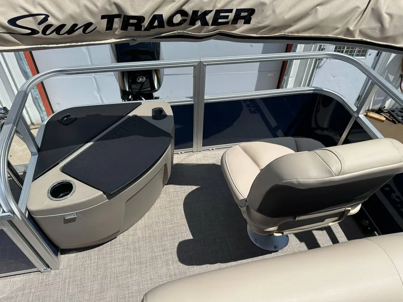 Slide: The Image of 2025 Sun Tracker Bass Buggy 18 DLX interior with seating and console. - 25