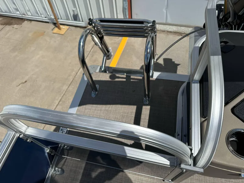 Slide: The Image of 2025 Sun Tracker Bass Buggy 18 DLX boat ladder and deck detail. - 27