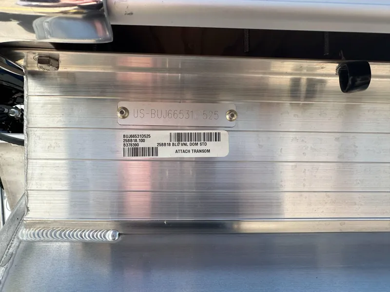 Slide: The Image of 2025 Sun Tracker Bass Buggy 18 DLX transom with identification plate and serial number. - 32