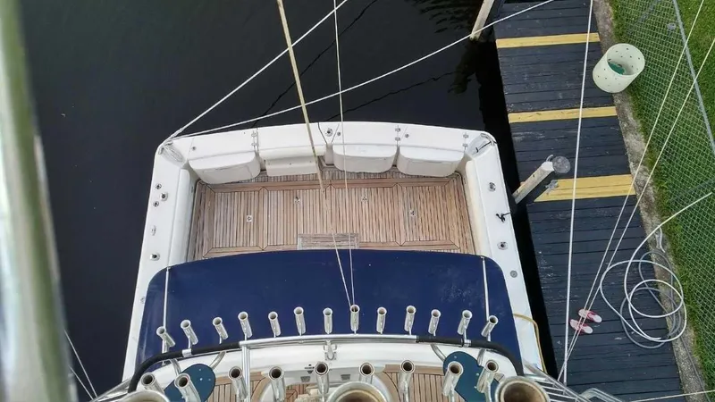 Slide: The Image of Top view of 2004 Riviera 58 Enclosed Flybridge yacht docked at marina. - 11
