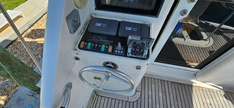Slide: The Image of Control panel of 2004 Riviera 58 Enclosed Flybridge with CAT Marine Power system. - 24