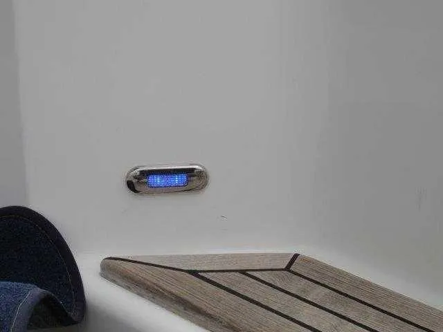 Slide: The Image of Blue LED light on 2004 Riviera 58 Enclosed Flybridge boat deck. - 38