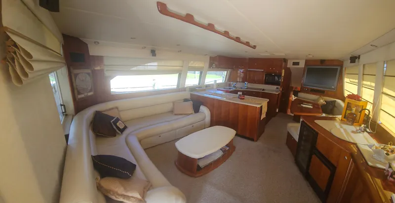 Slide: The Image of Luxurious interior of 2004 Riviera 58 Enclosed Flybridge yacht with modern amenities and elegant design. - 39