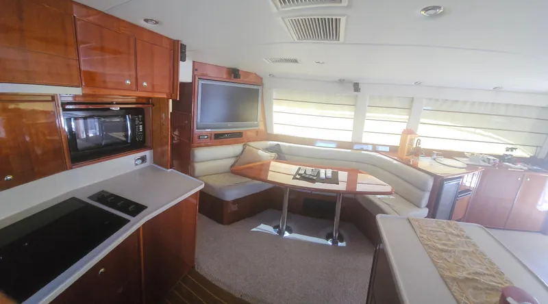 Slide: The Image of Luxurious interior of 2004 Riviera 58 Enclosed Flybridge yacht with modern amenities. - 46
